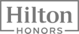 The image shows the Hilton Honors logo, featuring the text "Hilton" enclosed in a rectangle above "HONORS" in a bold, uppercase font.